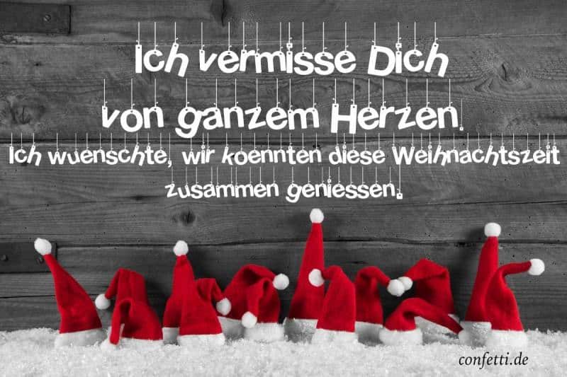 Vianočné prianie v nemčine na obrázku so santovskými čiapočkami na snehu